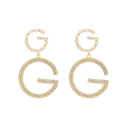 gucci golden earrings letter G