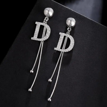 letter D earrings silver