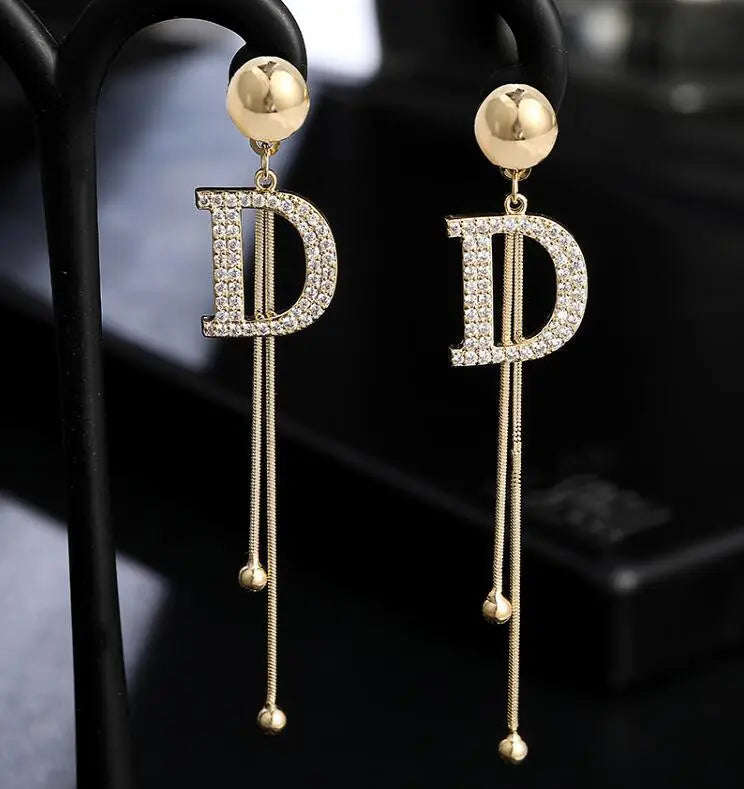 D letter golden earrings